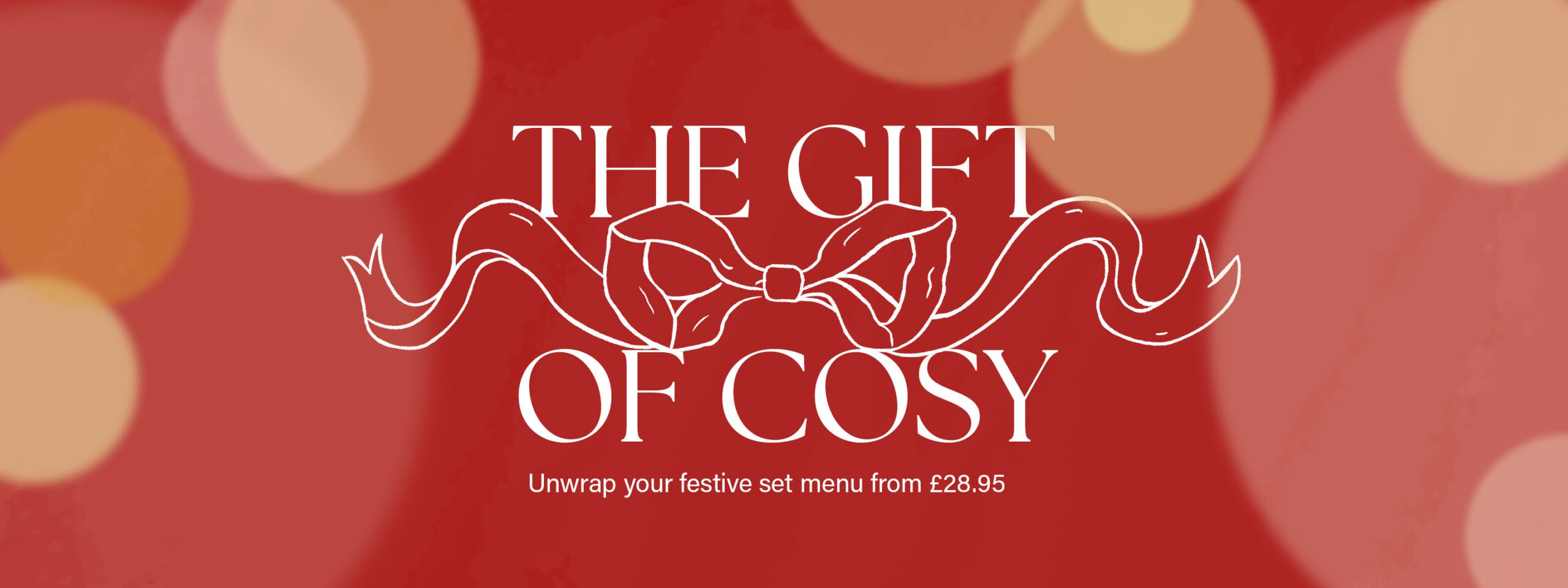 White text on a red background with light bokeh effects reads: "THE GIFT OF COSY" above a festive bow illustration. Smaller text below says: "Unwrap your festive set menu from £28.95.
